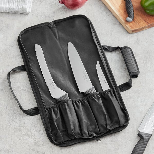 A Schraf knife roll with a set of knives inside.