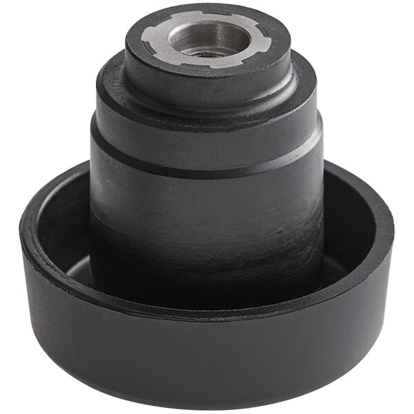 A black Waring drive coupling with a metal center hole.