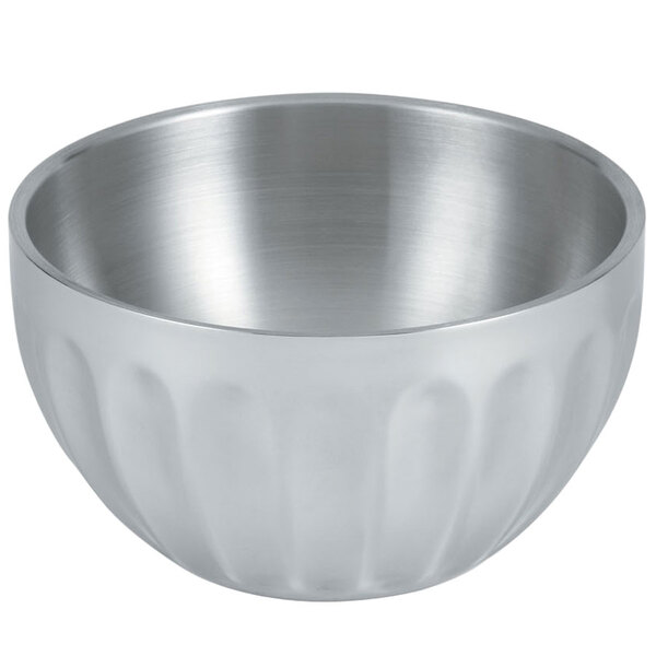 A silver stainless steel Vollrath fluted serving bowl with a ribbed rim.