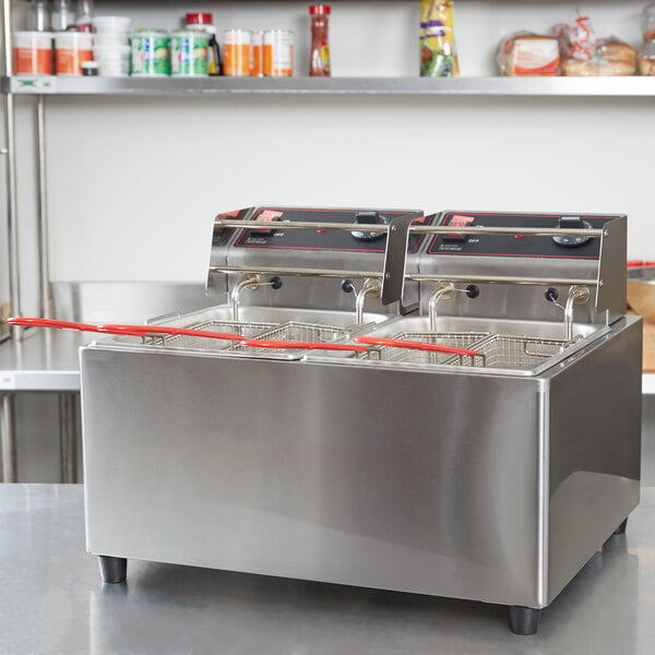 A Cecilware stainless steel electric countertop deep fryer with two large fry tanks and red handles.