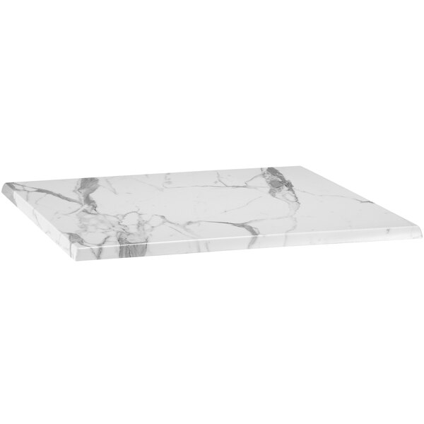 A white marble table top with black veins.