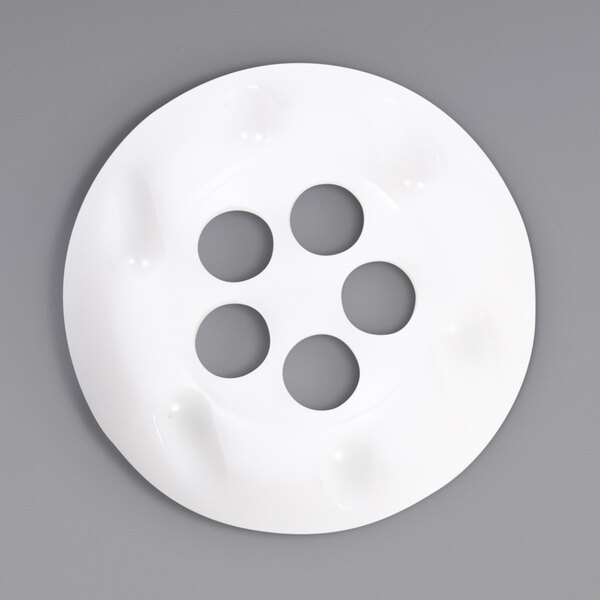 A white circular Carpigiani nozzle with 5 holes.