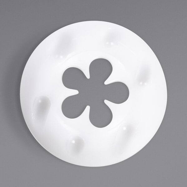A white circular Carpigiani flower shape with a flower cut out.