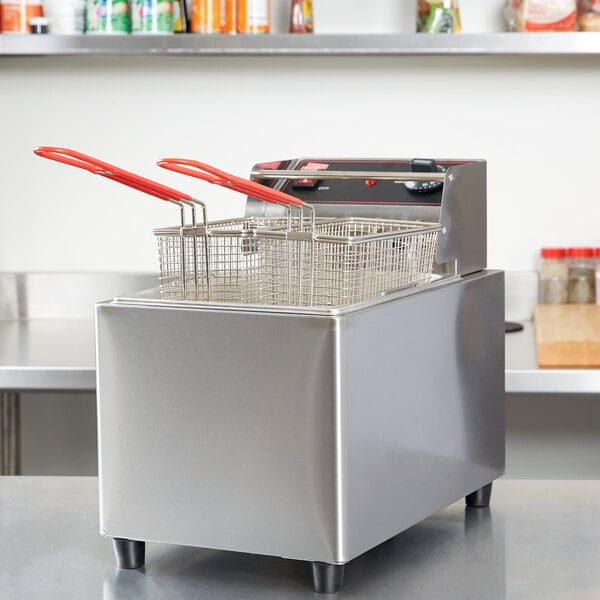 A Cecilware stainless steel electric countertop deep fryer with red plastic tongs.