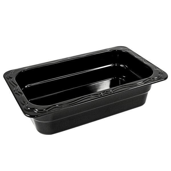 A black melamine food pan with a curved edge.