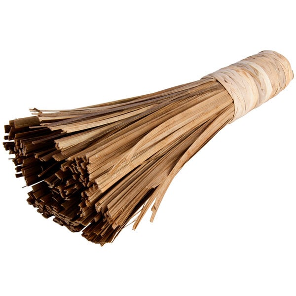 A Town bamboo wok brush with brown straw tied together.
