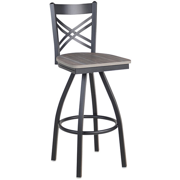 A black steel BFM Seating cross back bar stool with a wooden swivel seat.