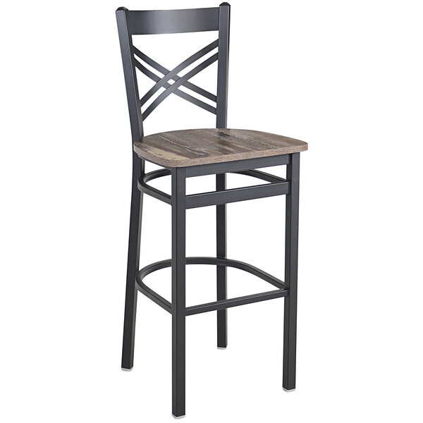 A BFM Seating black steel cross back barstool with a wood seat.