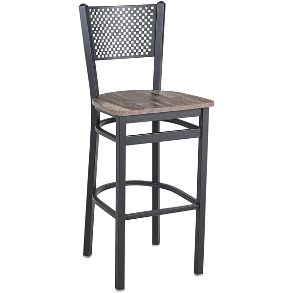 A BFM Seating black steel barstool with a wood seat.