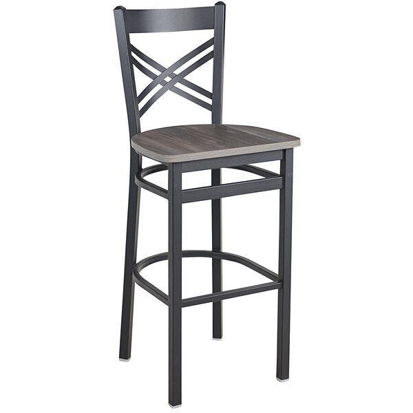 A BFM Seating black steel barstool with a wooden back and seat.