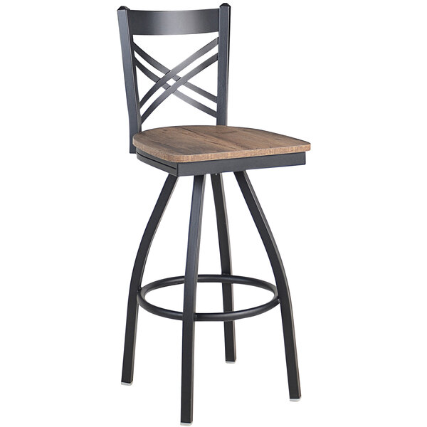 A black steel BFM Seating barstool with a wooden swivel seat and a cross back.