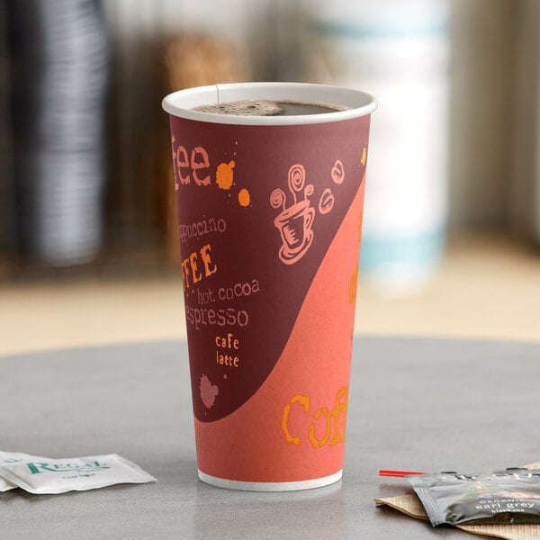 A close-up of a Choice coffee cup with coffee on a table.