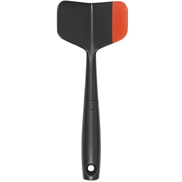 An OXO black and orange nylon chopper/turner with a white background.