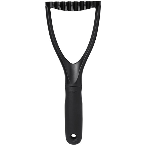 An OXO black plastic round-faced potato masher with a black handle.