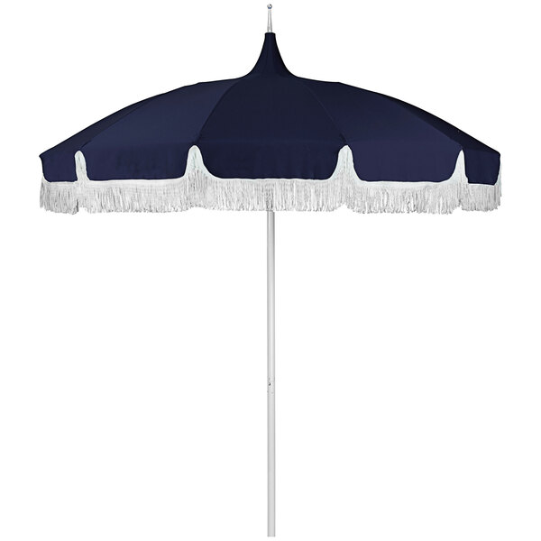 A navy California Umbrella with a Sunbrella canopy and white fringe.