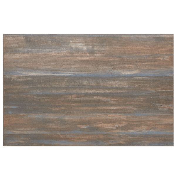 A wood surface with a blue and brown paint design on the edge and center.