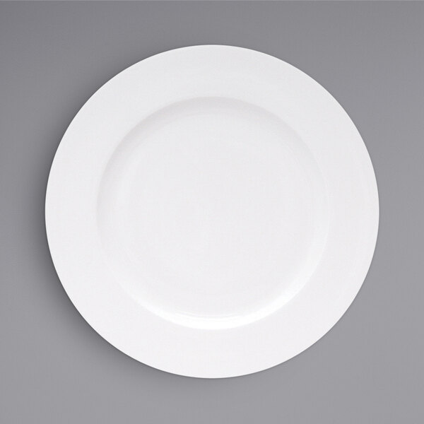 A close-up of a Fortessa Ilona bright white china plate with a wide white rim.