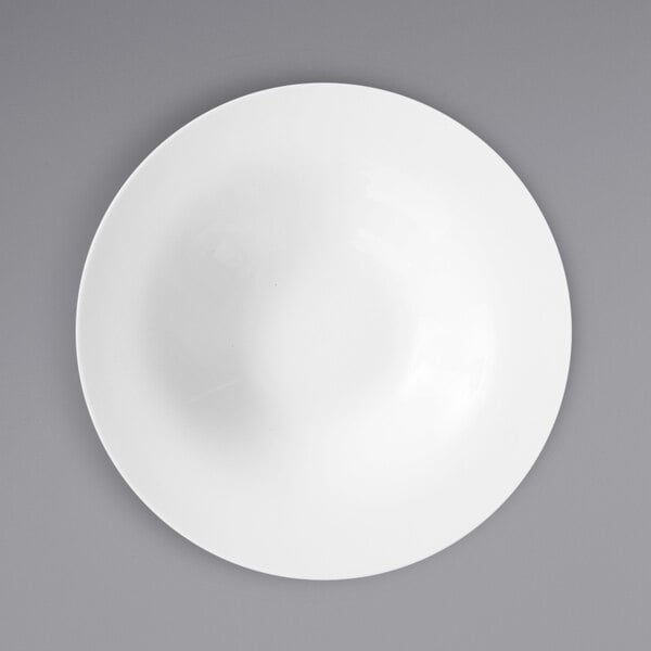 A Fortessa Ilona bright white china pasta bowl with a wide rim.
