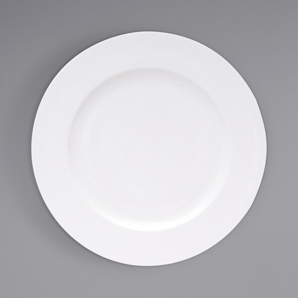 A close up of a Fortessa Ilona white china plate with a wide white rim.