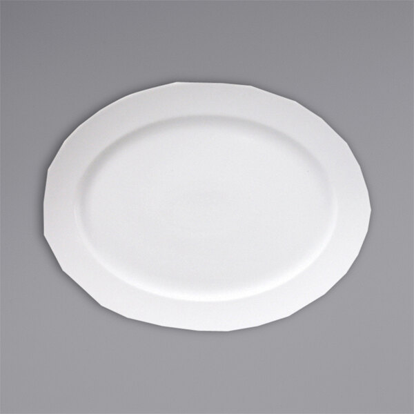 A Fortessa Ilona china platter with a white rim on a gray surface.