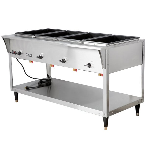 A Vollrath stainless steel electric hot food table with four sealed wells.