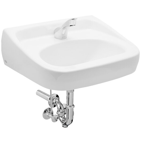 A white Zurn wall hung lavatory sink with a chrome Zurn sensor faucet.