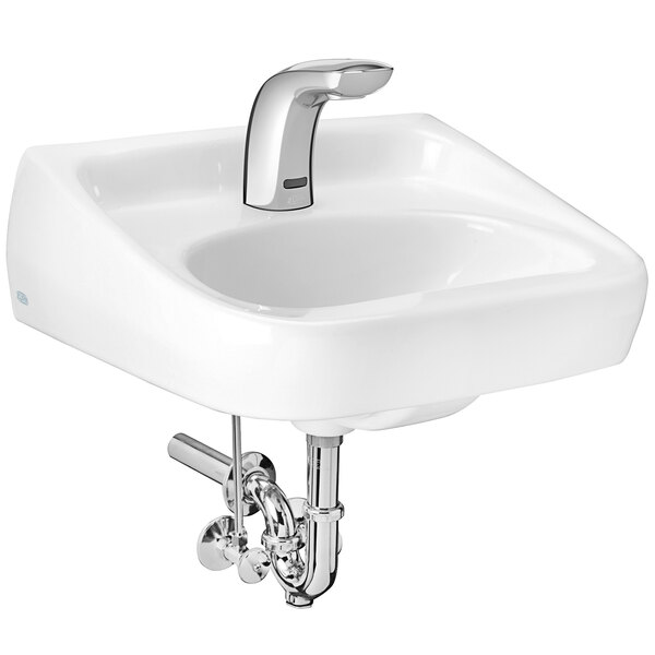 A white Zurn wall hung lavatory sink with a silver Zurn sensor faucet.