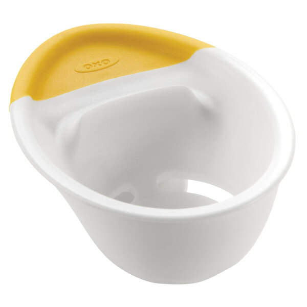 A white and yellow plastic OXO Good Grips container with a lid.