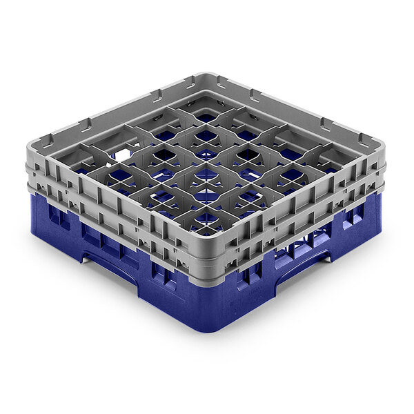 A navy blue and grey plastic Cambro glass rack with 16 compartments and 5 extenders.
