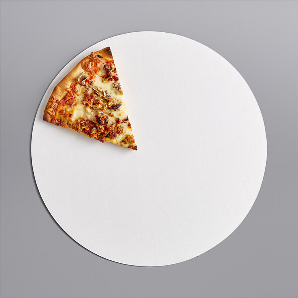 A slice of pizza on a white plate with a white corrugated pizza circle underneath.