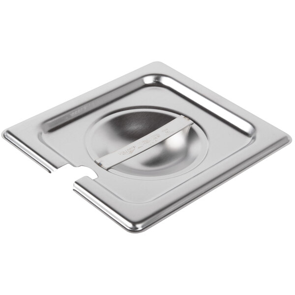 A Vollrath stainless steel steam table pan cover on a stainless steel pan.