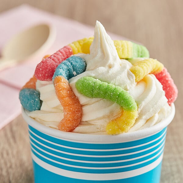 A cup of ice cream with Albanese Mini Gummi Worms on top.