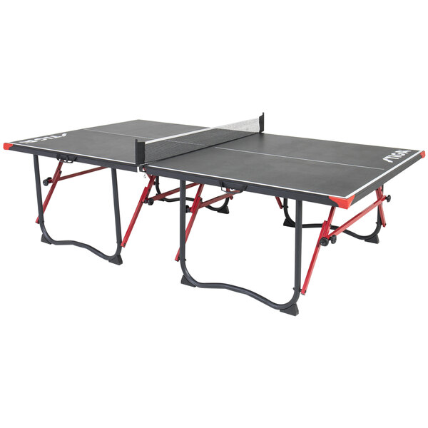 A black and red Stiga table tennis table with a net.