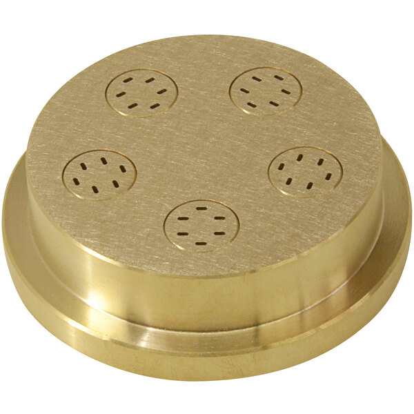 A gold circular brass disc with holes in it.