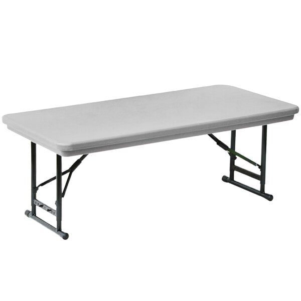 A white rectangular Correll plastic folding table with black legs.
