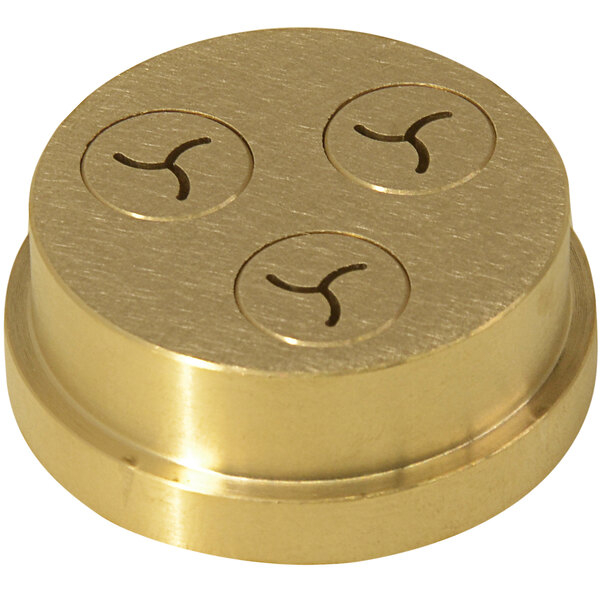 A gold circular brass Avancini Fusilli die with four holes.