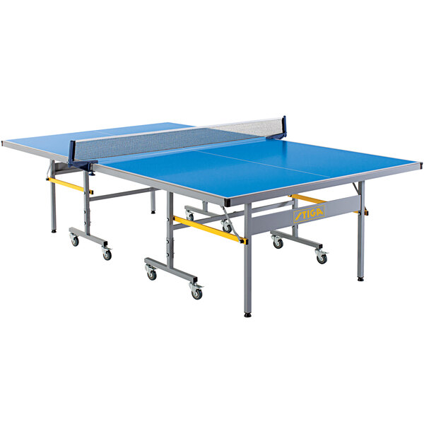 A blue Stiga Vapor ping pong table with metal legs and a net.