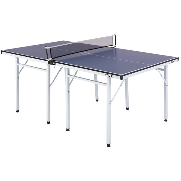 A Stiga T8460W Space Saver Compact Ping Pong Table with blue and black tops on a table with a net.
