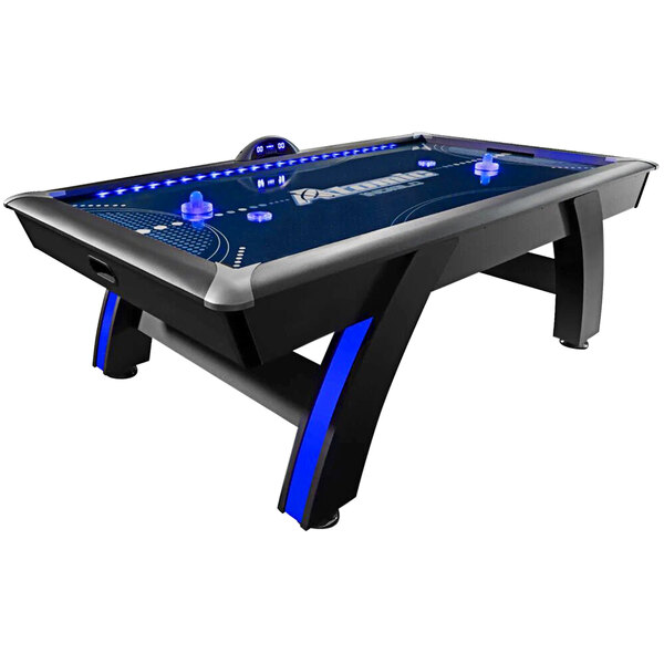 An Atomic air hockey table with blue LED lights.