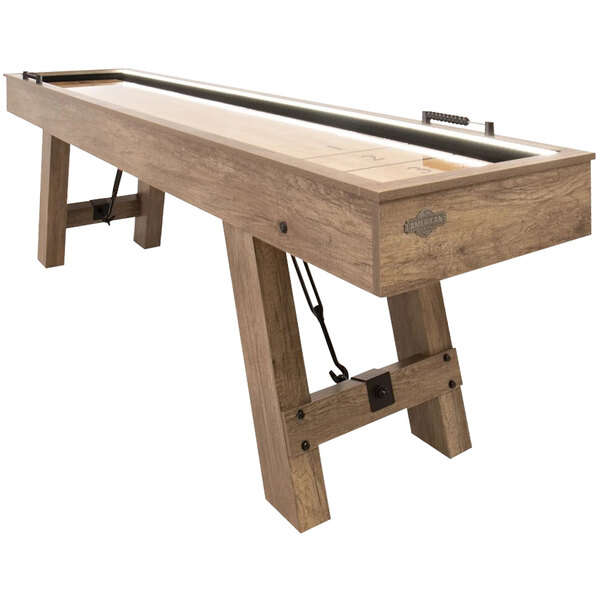 An American Legend Brookdale shuffleboard table with a wooden top and metal legs.