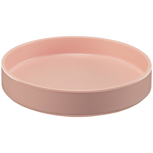 A pink round Cal-Mil melamine plate with a raised rim.