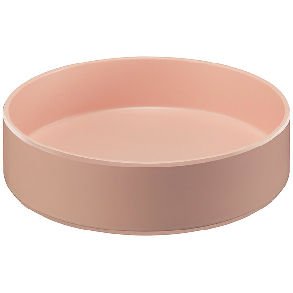 A stackable blush pink Cal-Mil melamine bowl.