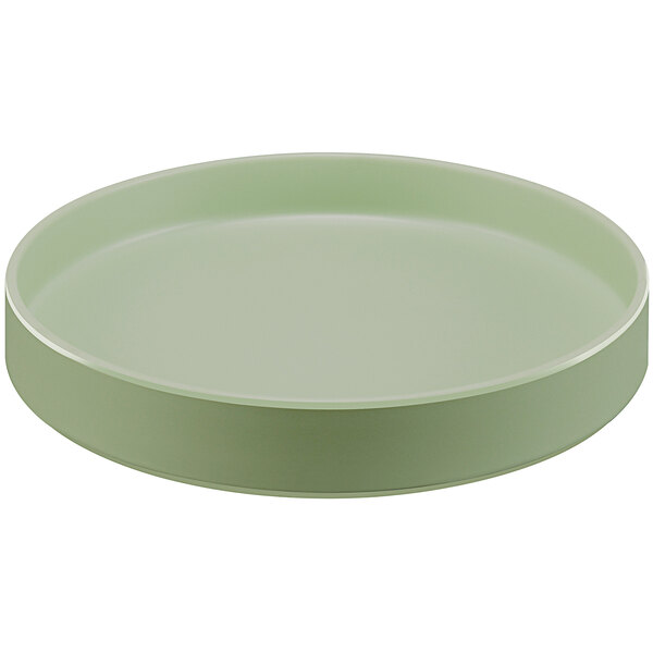 A round green Cal-Mil Hudson melamine plate with a raised rim.