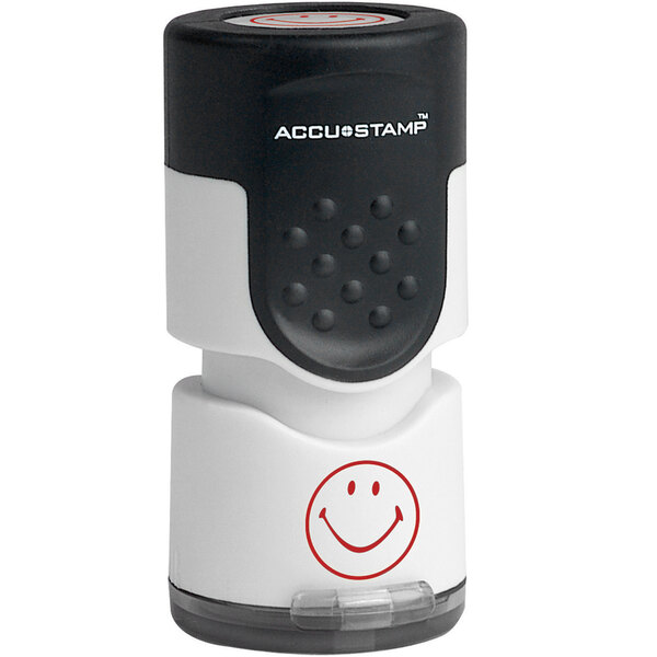 A white Accustamp stamper with a smiley face.