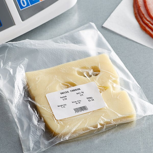 A package of cheese with a white food label on a counter.