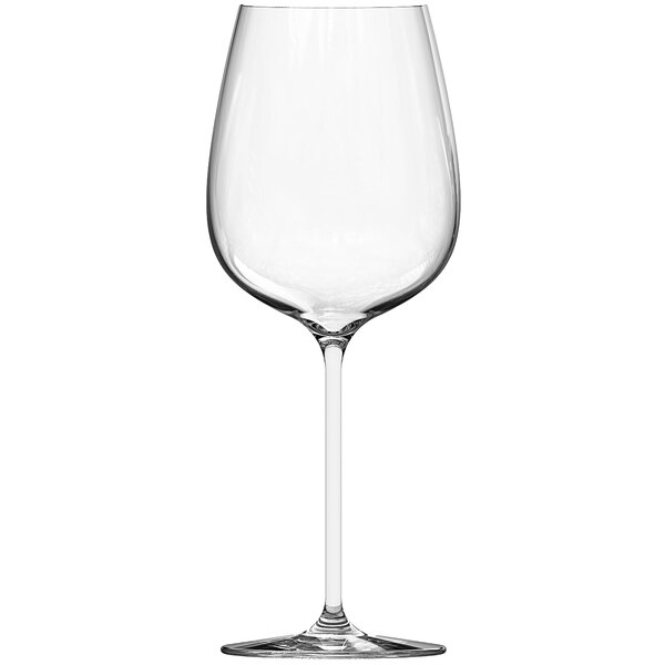 A close-up of a clear Chef & Sommelier Bordeaux wine glass with a long stem.