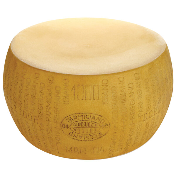 A round yellow cheese wheel with black text that reads "Parmesan Reggiano"