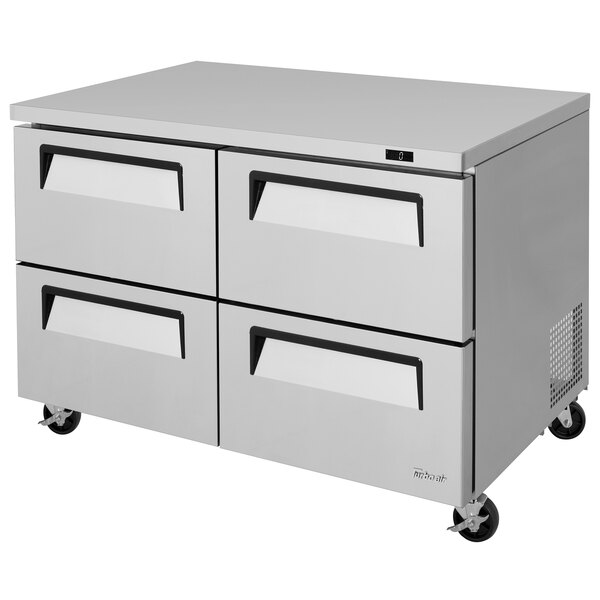 A white Turbo Air undercounter freezer with four drawers.