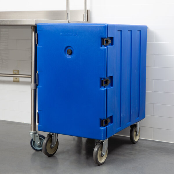 A navy blue Cambro cart with a single compartment for food storage containers on wheels.