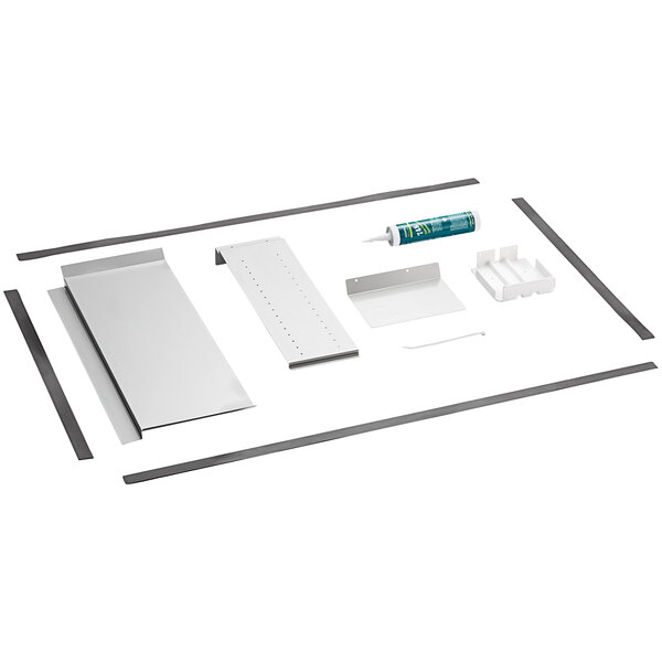 A white rectangular plastic tray with metal parts and tools.